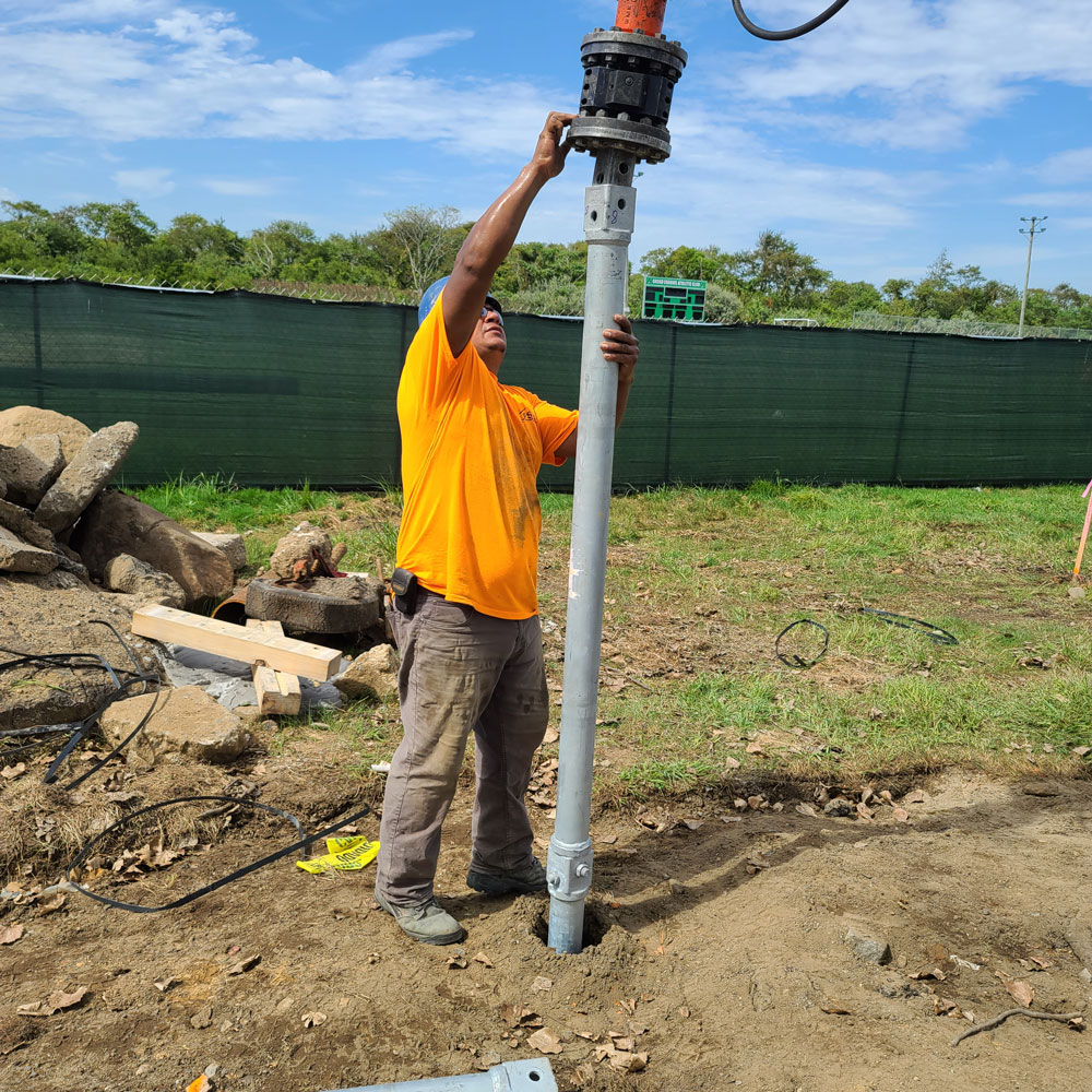 worker adjusting drill