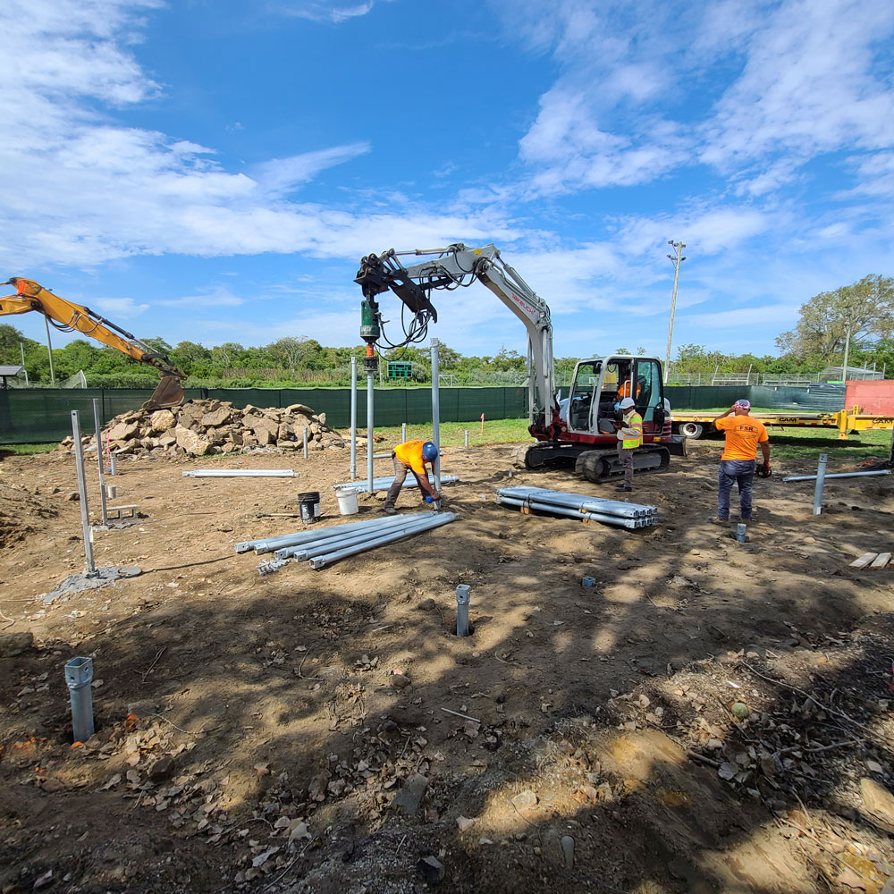 Premium Technical on site installing helical piles for new construction