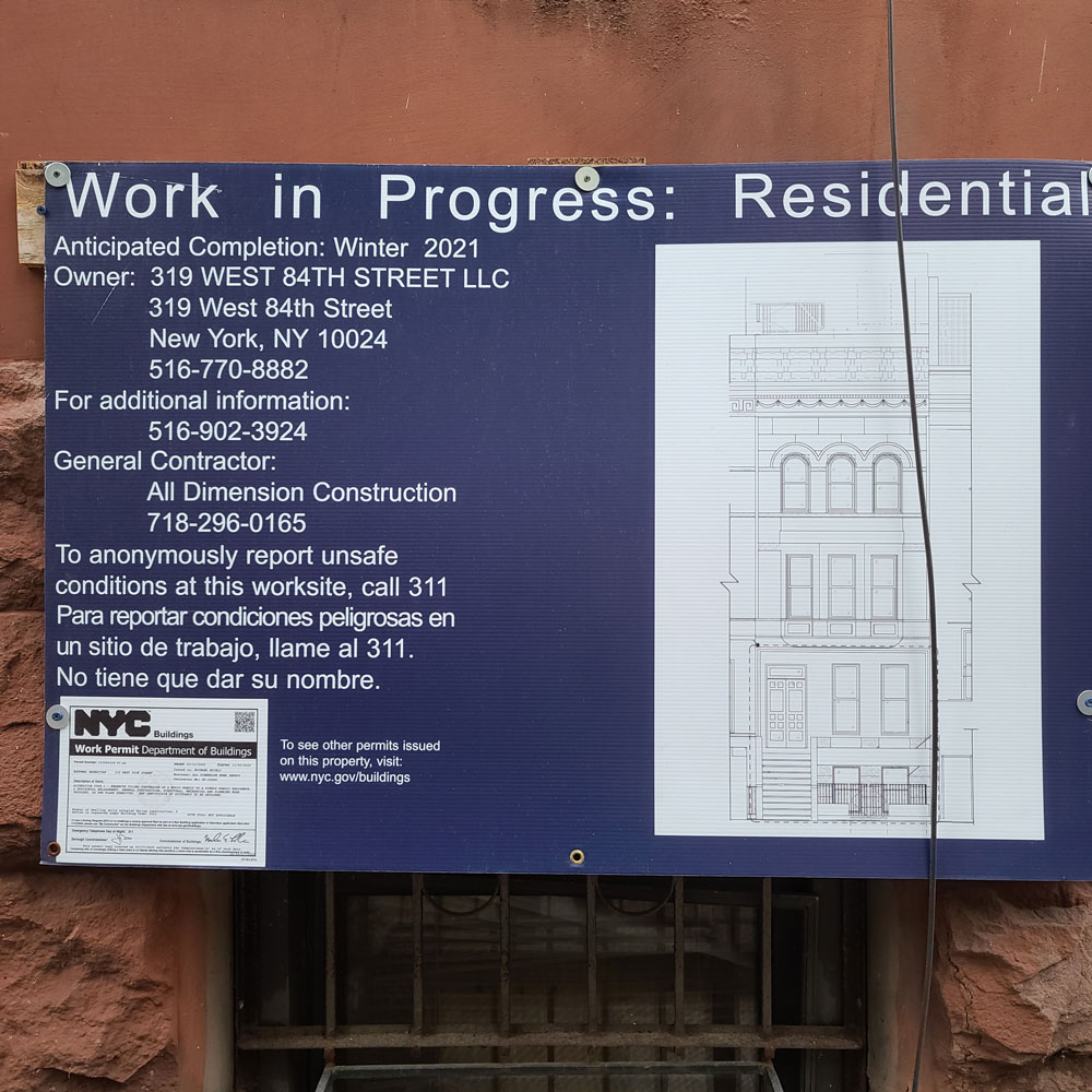 Work in Progress sign with building permit