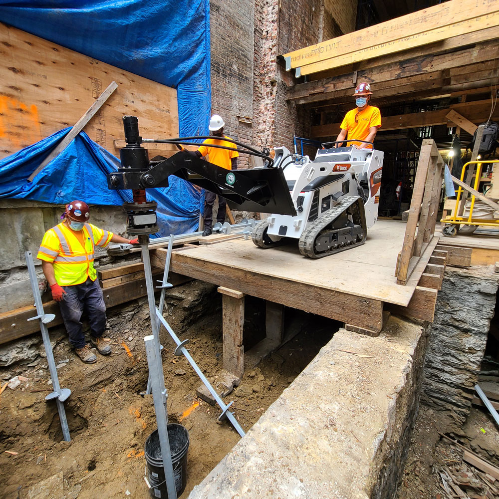 Bobcat on platform before drilling helical piles