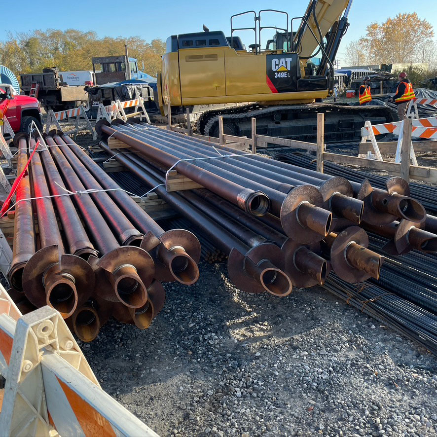 helical piles on site waiting for install