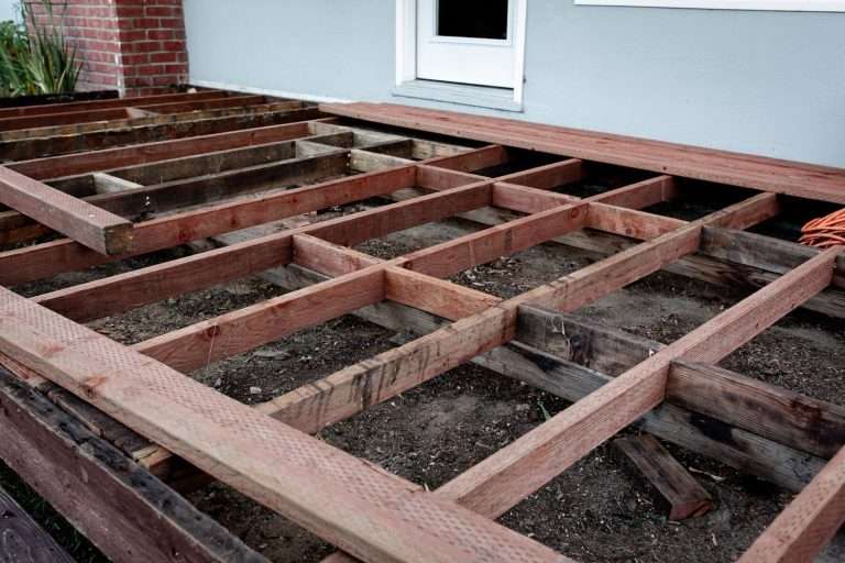 New deck frame built after deconstructing the backyard deck and removing the flooring until only the foundation is left