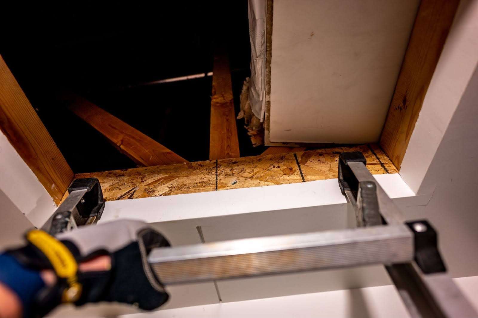 POV of technician looking down into crawl space